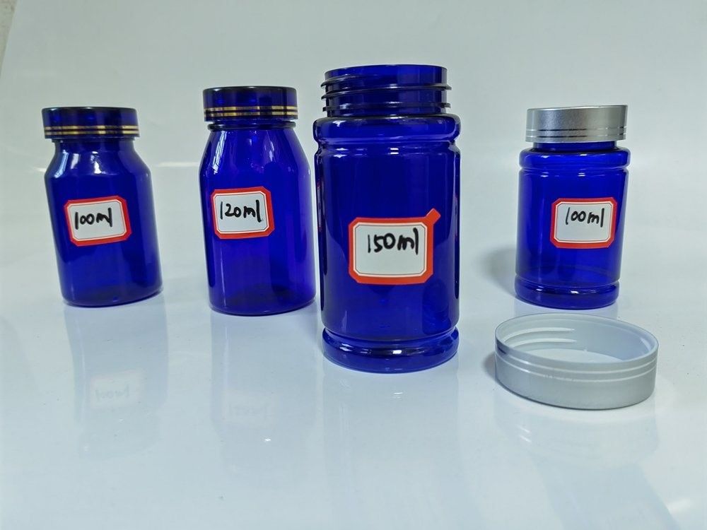 Botão de cápsulas de plástico azul PET de 100 ml com tampa de parafuso prateado